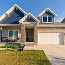 Suburban two-storey house with a driveway.