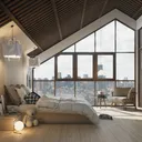 Loft bedroom with floor-to-ceiling windows.